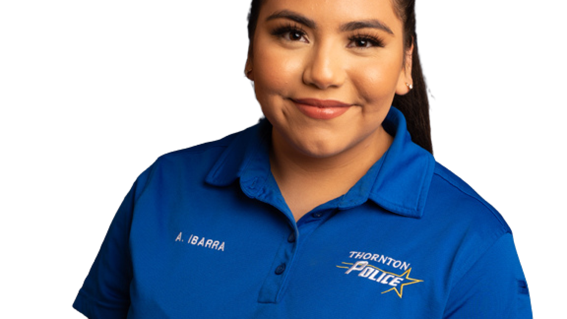Smiling person in a blue polo shirt against a plain background.
