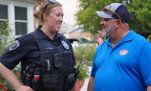 officer talking to community member